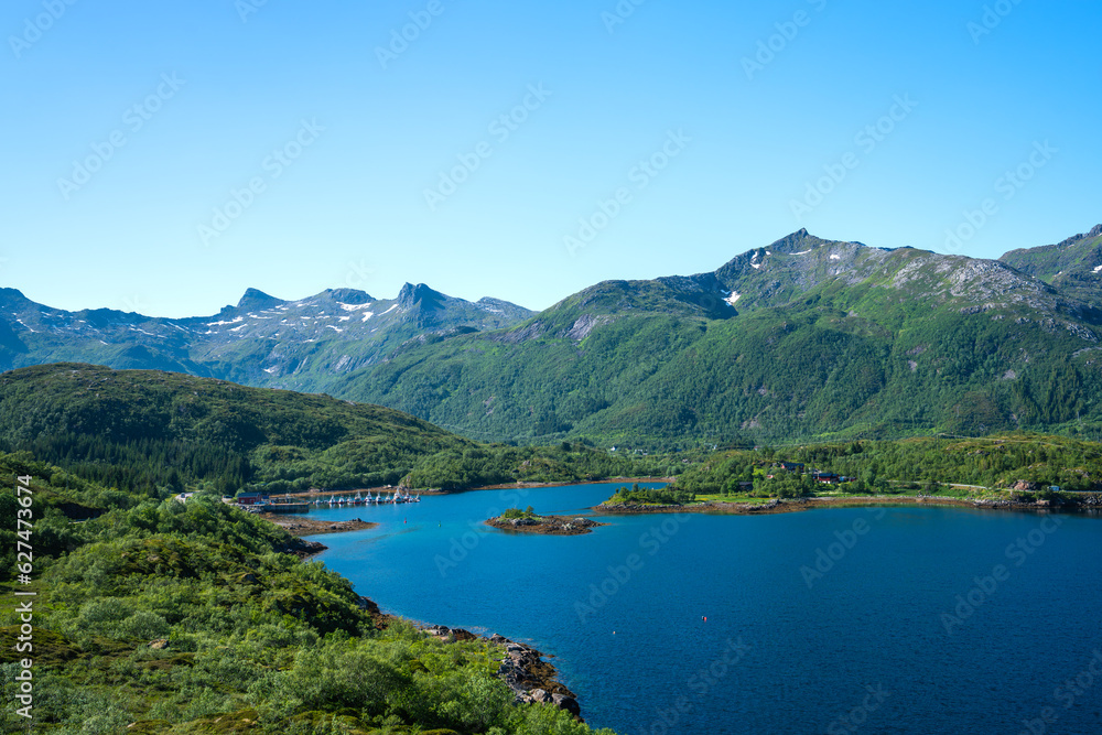 Amazing view at Lofoten islands Austvagoya, Austnesfjorden, Norway. Fjord summer landscape travelers rest area. Nordland, Coastline sea, ocean with mountains in background Amazing view at Lofoten islands Austvagoya, Austnesfjorden, Norway. Fjord summer landscape travelers rest area. Nordland, Coastline sea, ocean with mountains in background