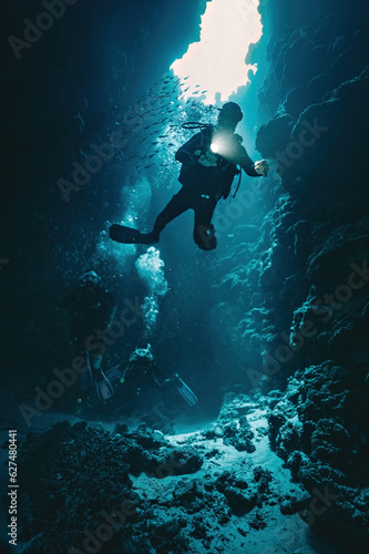 Man diver in Canyon dive site in Red Sea Egypt
