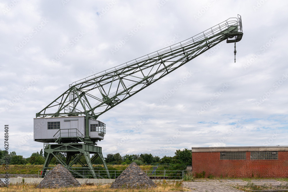 Port crane in the river port for loading ships. Port crane in the river port for loading ships.