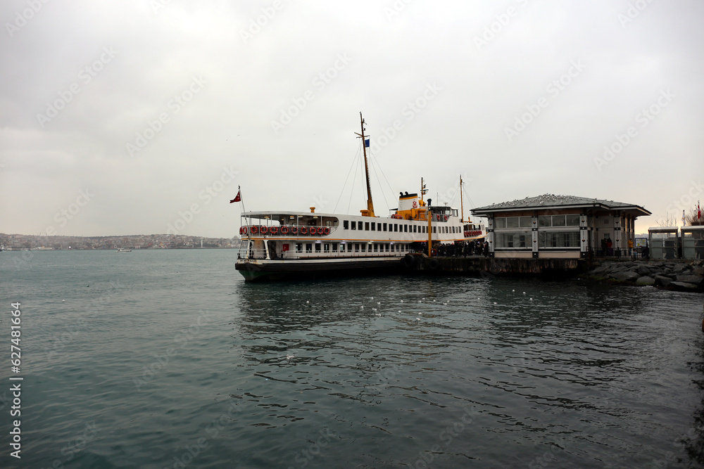 A ferry docked at the pier to embark and disembark passengers in the Bosphorus Istanbul