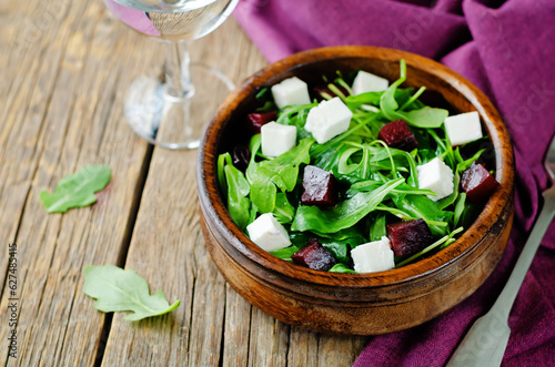 Arugula beet goat cheese salad in a bowl