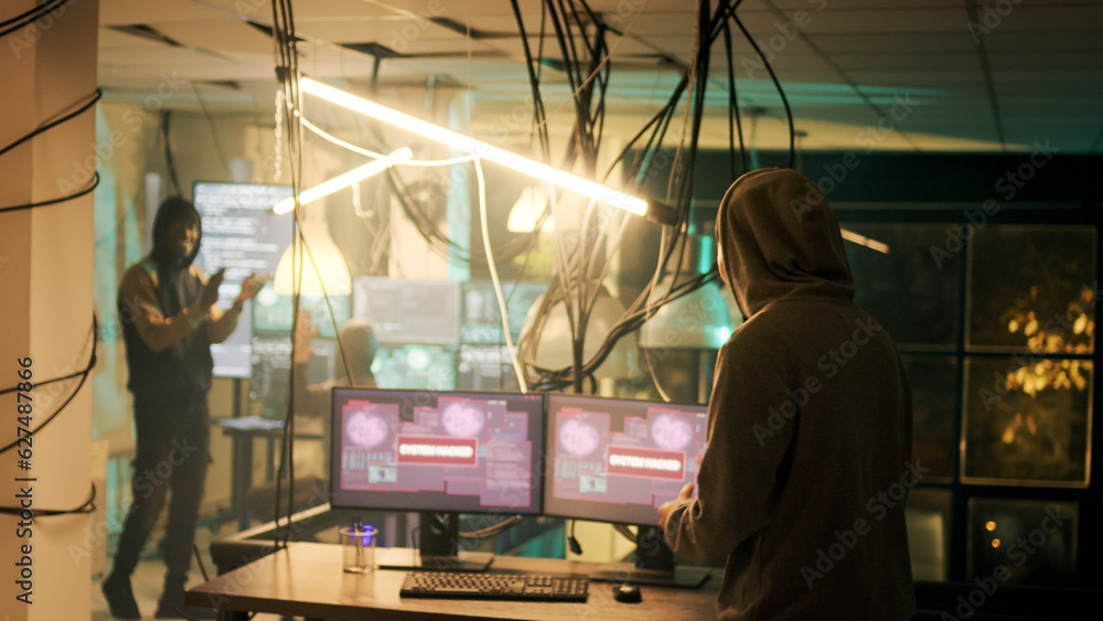 Diverse people applauding young hacker about cyberwarfare success, celebrating illegal activity achievement at night. Cyber criminals feeling happy about successfully stealing government data. Diverse people applauding young hacker about cyberwarfare success, celebrating illegal activity achievement at night. Cyber criminals feeling happy about successfully stealing government data.