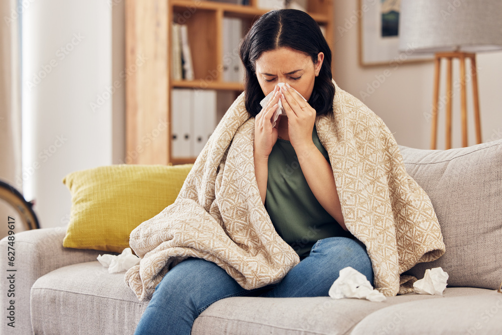 Tissue, blow nose and woman on sofa for home self care with virus, sick and healthcare or