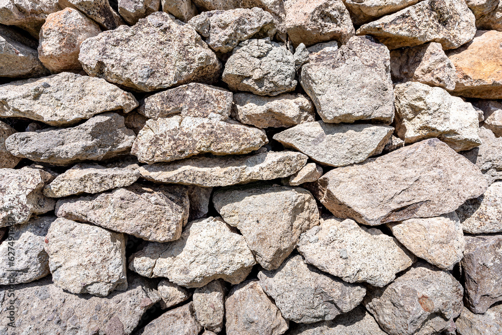 Obraz premium Texture of a stone wall. Old castle stone wall texture background. Stone wall as a background or texture. Part of a stone wall, for background or texture