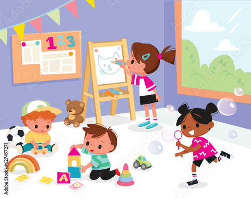 Kids play together in kindergarden. Playroom with children.