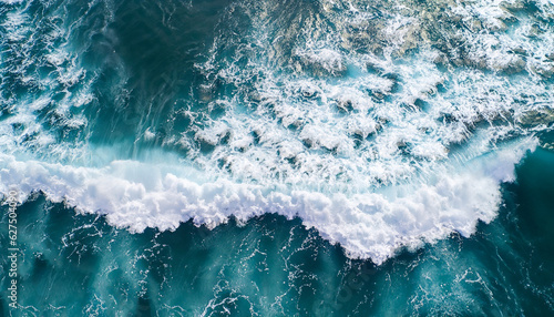 Fototapeta Naklejka Na Ścianę i Meble -  Spectacular aerial top view background photo of ocean sea water white wave splashing in the deep sea. Drone photo backdrop of sea wave in bird eye waves.
