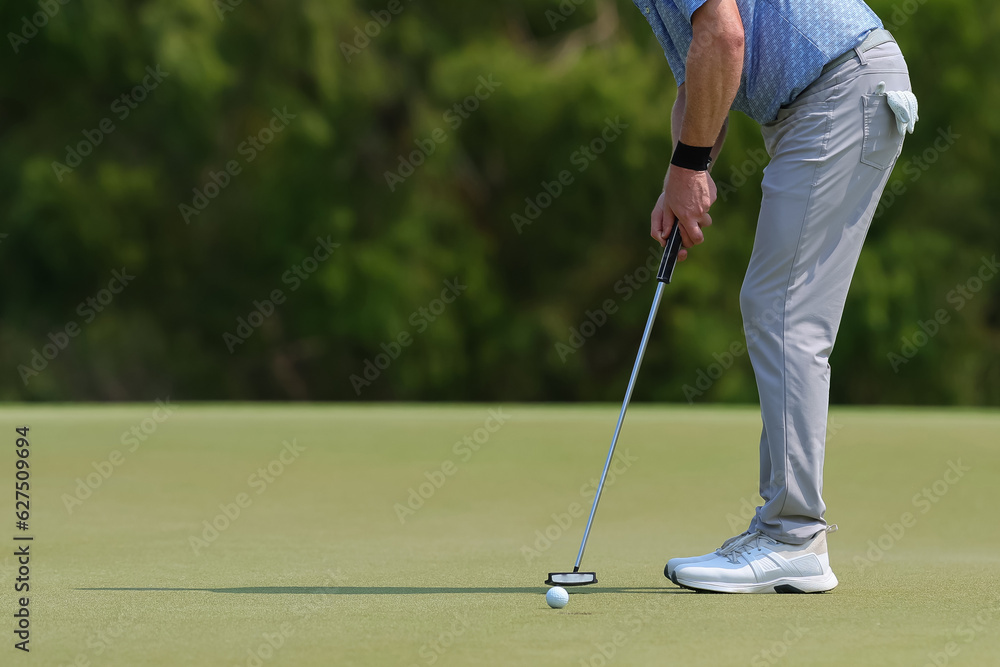 Fototapeta premium professional golf player hitting the ball