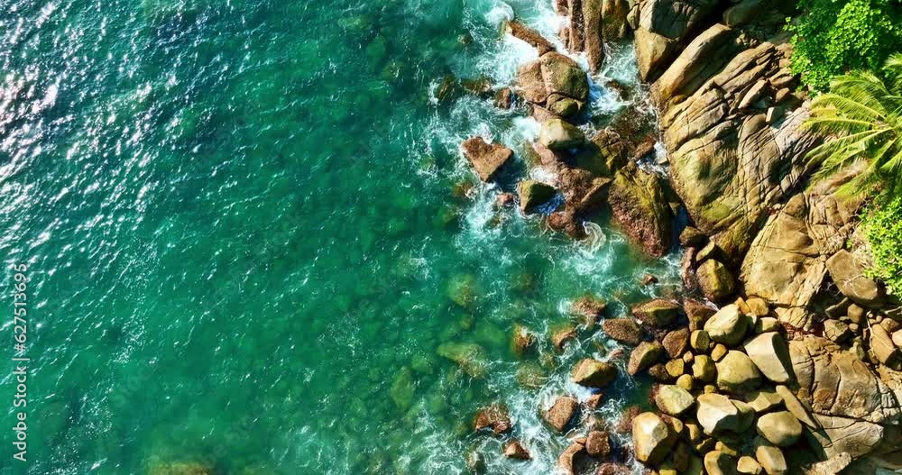 Aerial view Drone camera top down of seashore rocks in ocean, Beautiful sea surface, Amazing sea waves crashing on rocks seascape in Phuket island Thailand, Aerial view drone 4k High quality footage Aerial view Drone camera top down of seashore rocks in ocean, Beautiful sea surface, Amazing sea waves crashing on rocks seascape in Phuket island Thailand, Aerial view drone 4k High quality footage