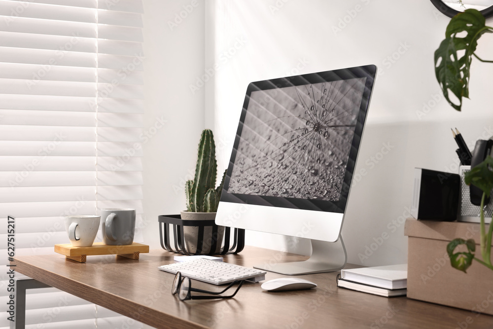 Fototapeta premium Cozy workspace with computer on wooden desk at home
