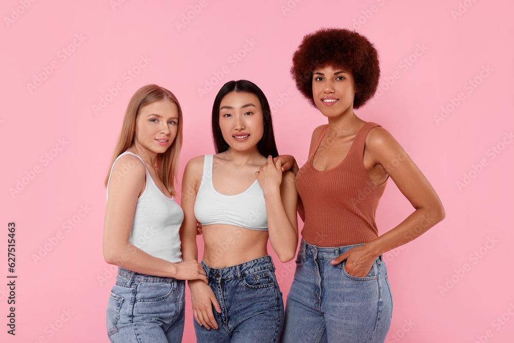 Fototapeta premium Portrait of beautiful young women on pink background