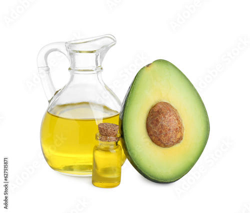 Oil and fresh cut avocado isolated on white