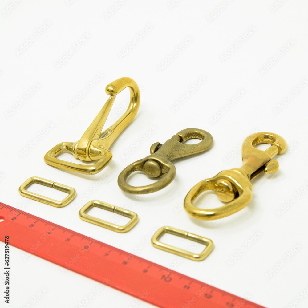 A collection of metal fittings used for leather products A collection of metal fittings used for leather products