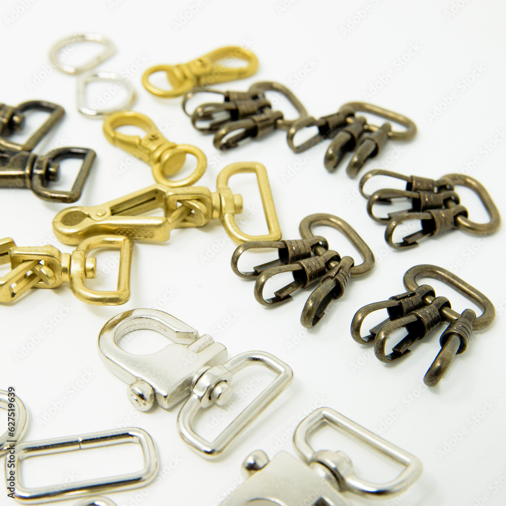 A collection of metal fittings used for leather products