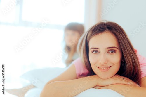 Free Download Happy Mother and Daughter Waking up in the Morning. Cheerful family relaxing in the bedroom at home
 - GFXLoad
