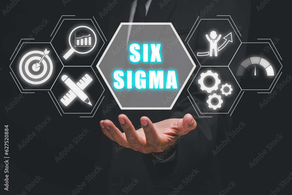 Six sigma concept, Business person hand holding six sigma icon on virtual screen. Six sigma concept, Business person hand holding six sigma icon on virtual screen.