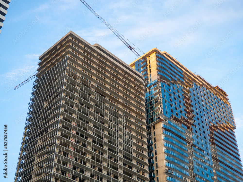 Construction of modern high-rise buildings. Looking up. Unfinished building. big business. Construction of modern high-rise buildings. Looking up. Unfinished building. big business.