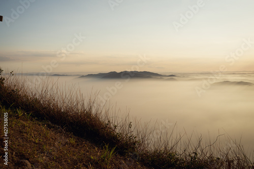 View of the sunset in the mountains with a lot of fog