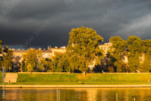 Heavy rain and rainbow above the Vistula river in Krakow Poland. Stunning views of the city rainy season and rainbow. Sky  panoramic views. 