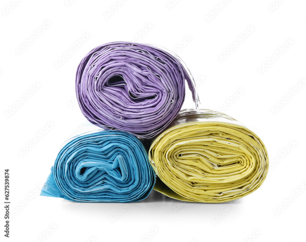 Colorful rolls of garbage bags isolated on white background