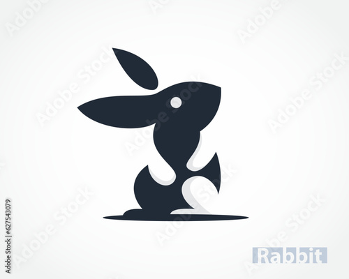 cartoon easter bunny rabbit looking up with hand and foot negative space logo design template illustration