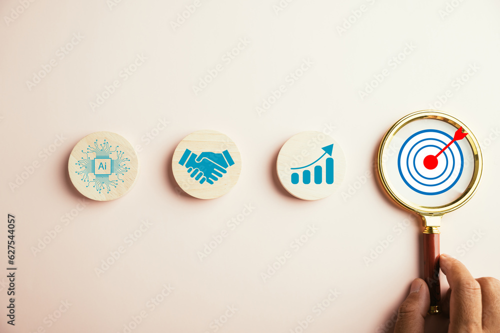 Target icon under magnifying glass, portraying essence of start-ups ...