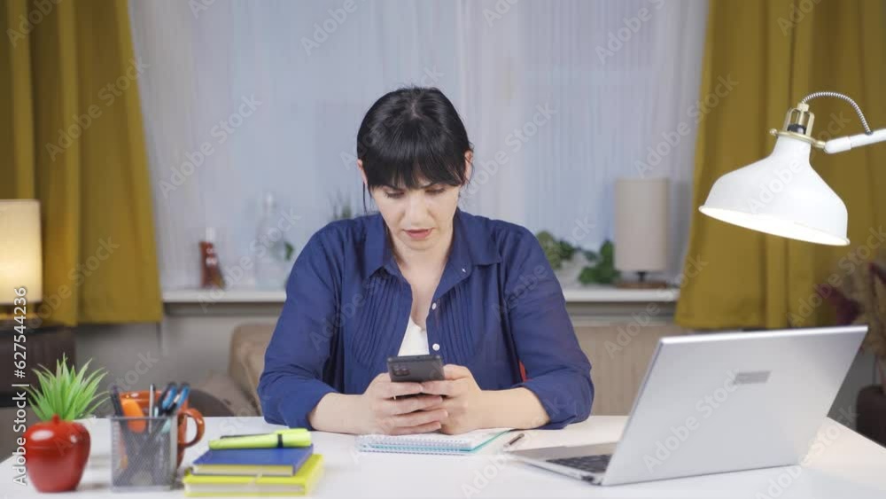 The Female student throwing the phone is angry. The Female student throwing the phone is angry.