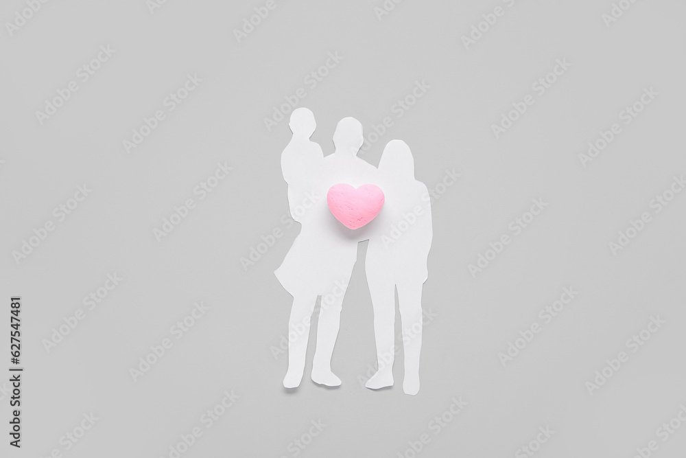 Figures of family with heart on grey background. Family love concept Figures of family with heart on grey background. Family love concept
