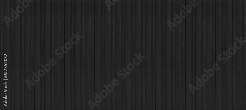 Foto rusty black metal siding fence striped background