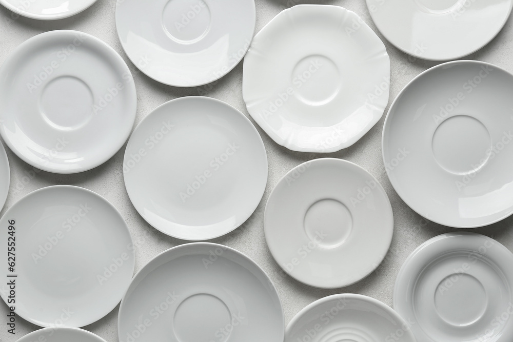 Many clean white plates on white background Many clean white plates on white background