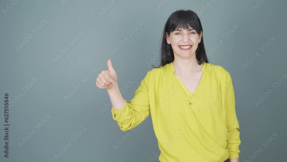The woman promoting is pointing to the side and laughing. The woman promoting is pointing to the side and laughing.