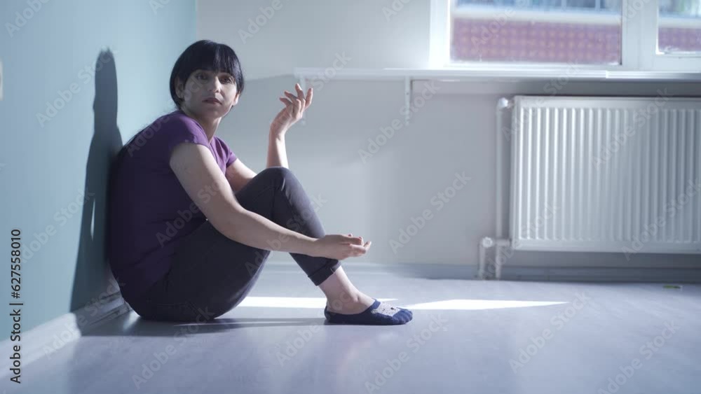 Depressed woman talking to camera. Depressed woman talking to camera.