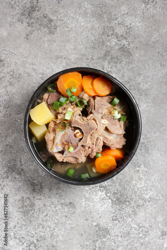 Sop Buntut or Sup Buntut is Indonesian Oxtail Soup with Carrot, Potato and Spring Onions.