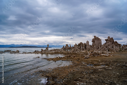 Scenic view of South Tufa rock formations at Mono Lake, near Lee Vining, Mono County, California, USA. Unique saline soda lake in Mono Basin, Sierra Nevada. Calcium carbonate minerals. Overcast photo