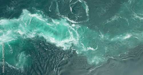 Strong tidal Saltstraumen maelstrom current with blue vortex whirlpools; drone