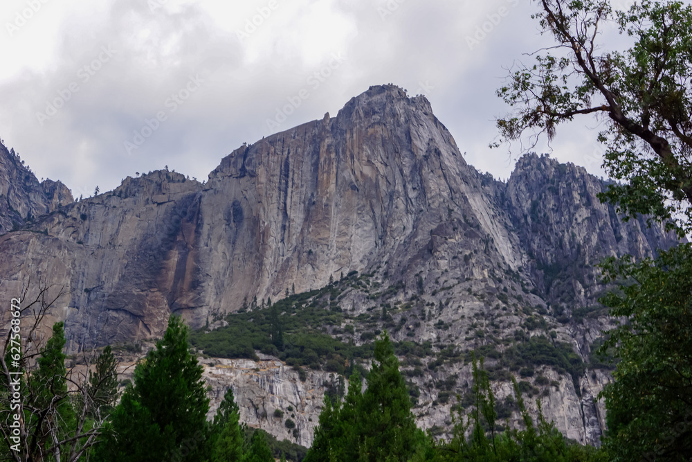 Great vistas of massive granite monoliths El Capitan seen from Yosemite Valley floor in Yosemite National Park, California, United States of America, USA. Spectacular vertical rise of the rock cliff