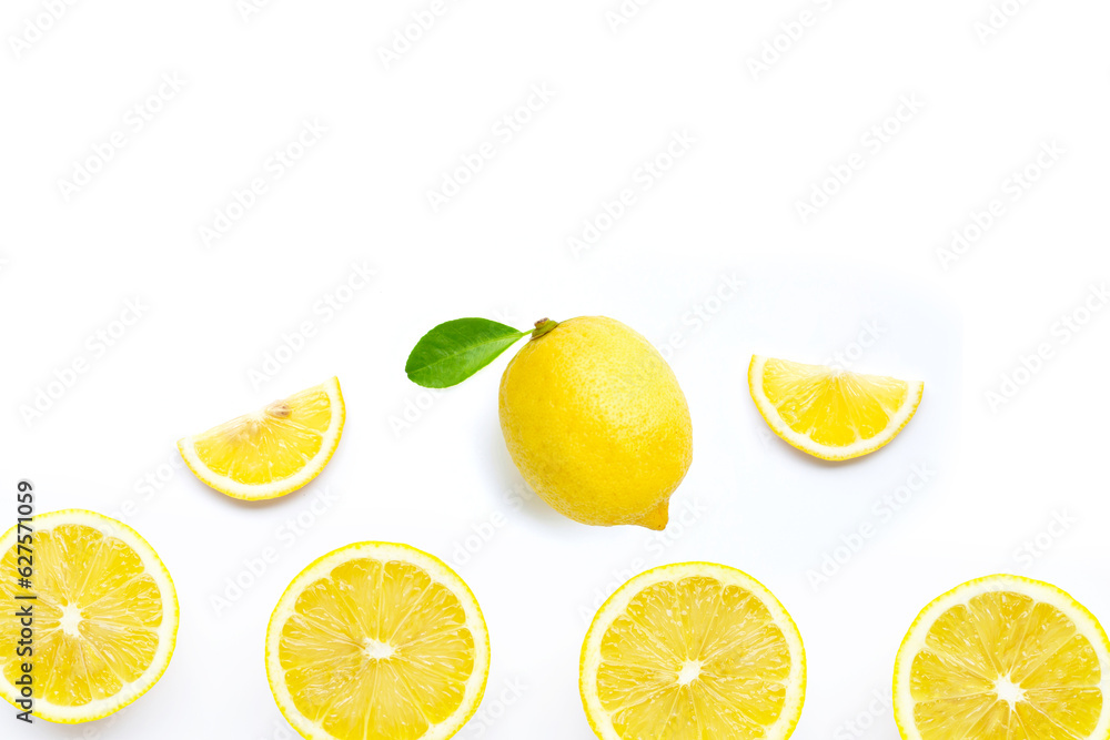 Fresh lemon with green leaf on white