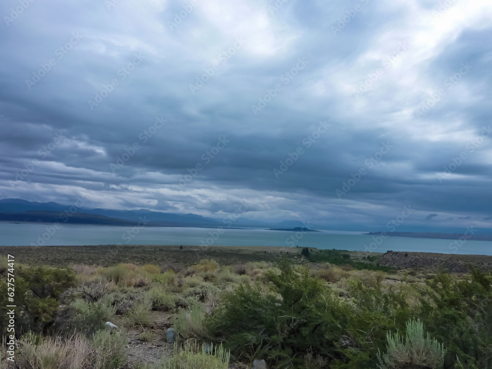 Panoramic view of Mono Lake, near Lee Vining, Mono County, California, USA. Unique saline soda lake in Mono Basin, Sierra Nevada. Calcium carbonate minerals. Barren grassland and small hills