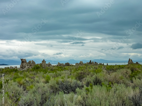 Scenic view of South Tufa rock formations at Mono Lake, near Lee Vining, Mono County, California, USA. Unique saline soda lake in Mono Basin, Sierra Nevada. Calcium carbonate minerals. Grassland photo