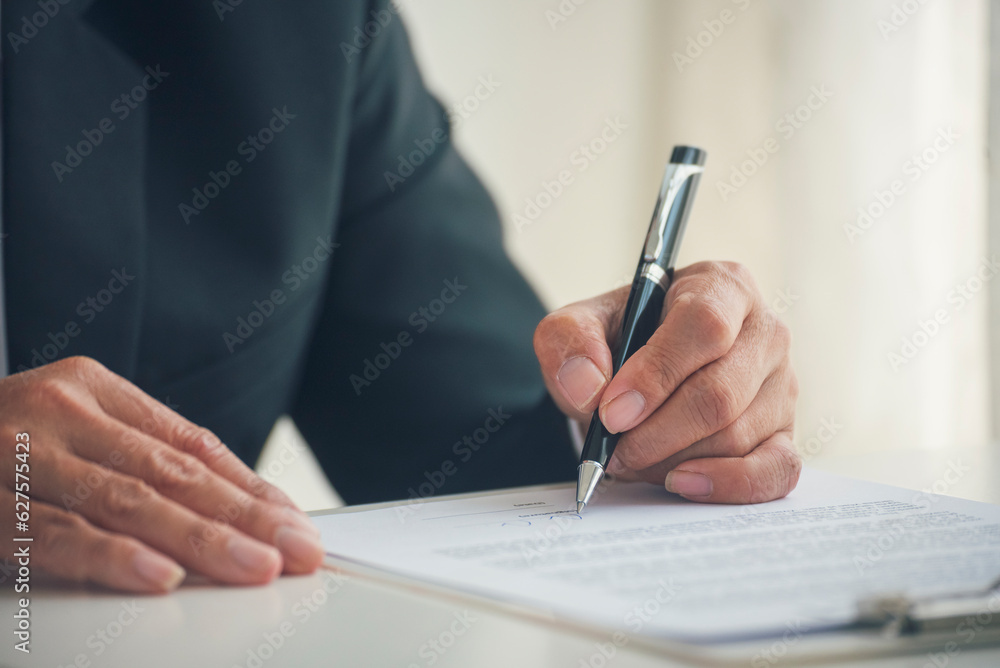 Asian business man using pen signing on new contract to starting projects in conference room. Close up manager businessman hands sign contract working meeting. Business agreement concepts. Asian business man using pen signing on new contract to starting projects in conference room. Close up manager businessman hands sign contract working meeting. Business agreement concepts.