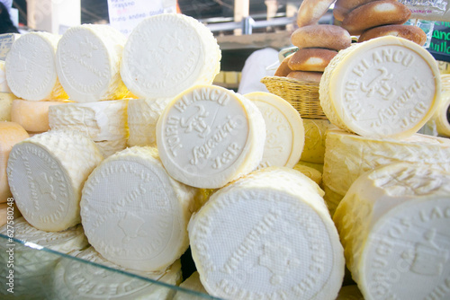 Top quality Peruvian organic cheeses in a market stall in the city of Cusco, Peru.