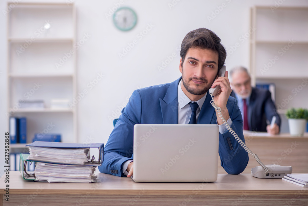 Two male colleagues working in the office Two male colleagues working in the office