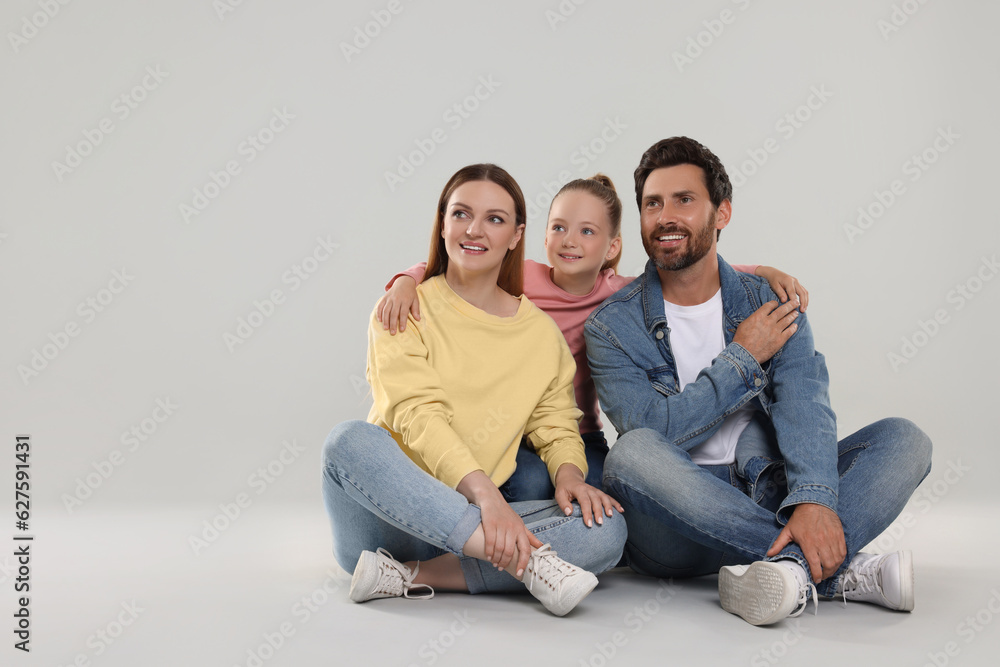Happy family on light grey background, space for text Happy family on light grey background, space for text