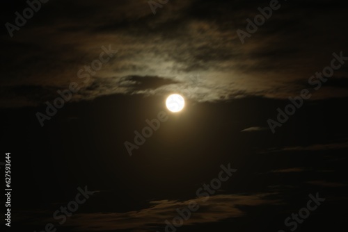 Picturesque view of night sky with full moon and clouds © New Africa