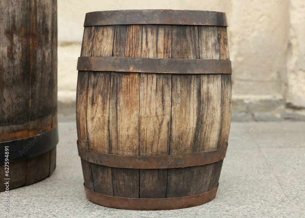 Obraz premium Traditional wooden barrel on street outdoors. Wine making