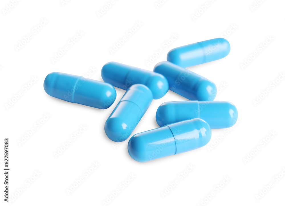 Many light blue pills isolated on white Many light blue pills isolated on white