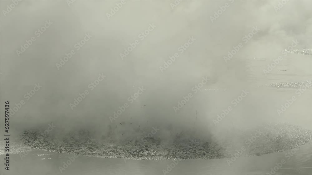 Boiling hot geothermal volcanic mud pool, closeup shot steamy lake bubbling mud and steam Boiling hot geothermal volcanic mud pool, closeup shot steamy lake bubbling mud and steam