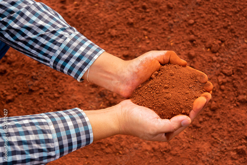 Dirty hands holding dry soil, Agriculture, Organic gardening, Planting or ecology concept, Environmental, Top view, Copy space, Farmer checking before sowing.