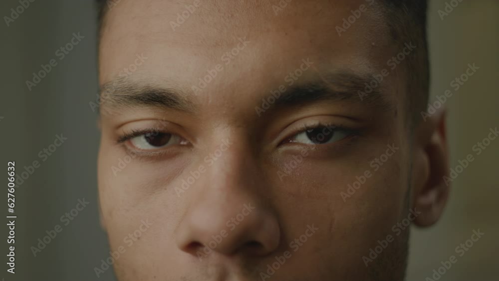 Black Man Eyes Opening Close Up. African American face smiling looking at camera. Black Man Eyes Opening Close Up. African American face smiling looking at camera.