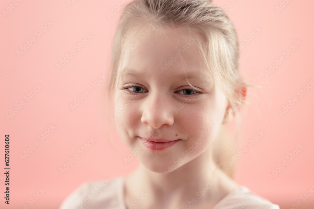 portrait of blond caucasian smiling cute girl on pink background portrait of blond caucasian smiling cute girl on pink background