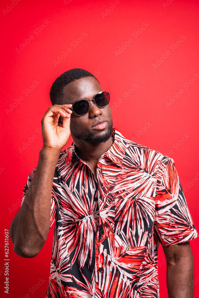 Stylish black man in sunglasses tropical shirt Stylish black man in sunglasses tropical shirt